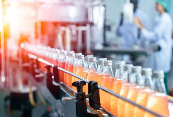 Juice beverage bottles moving along a production line