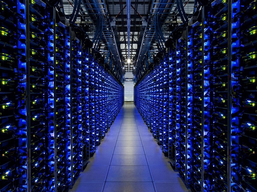 Aisle of server racks in a data center